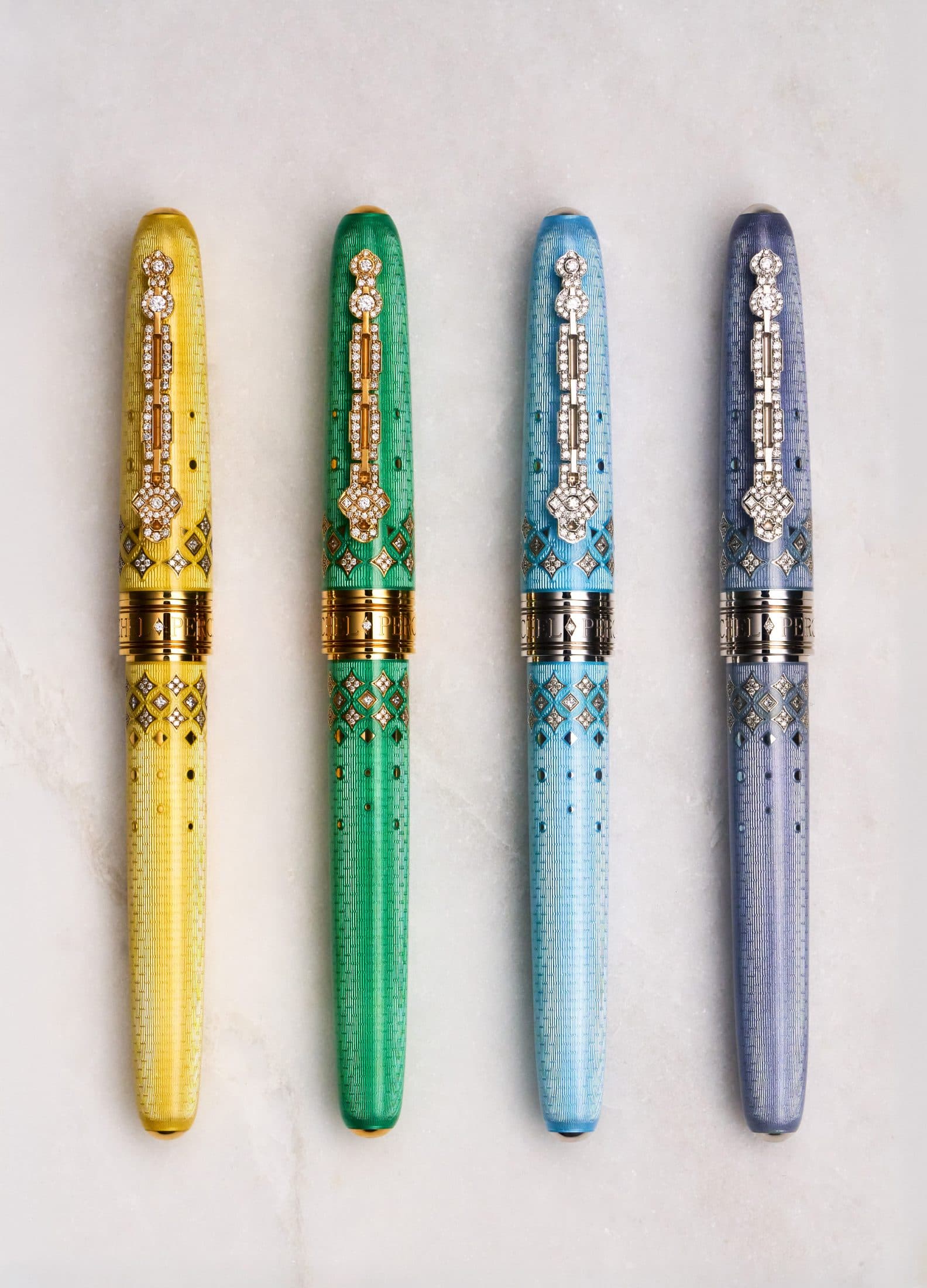 Four Michel Perchin Majesty fountain pens on Carrara marble